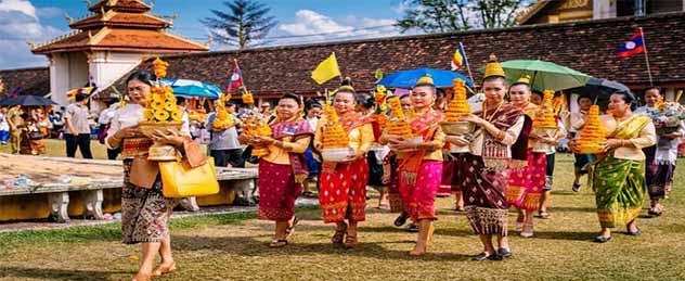 Traditional Lao dance performance with dancers in silk costumes